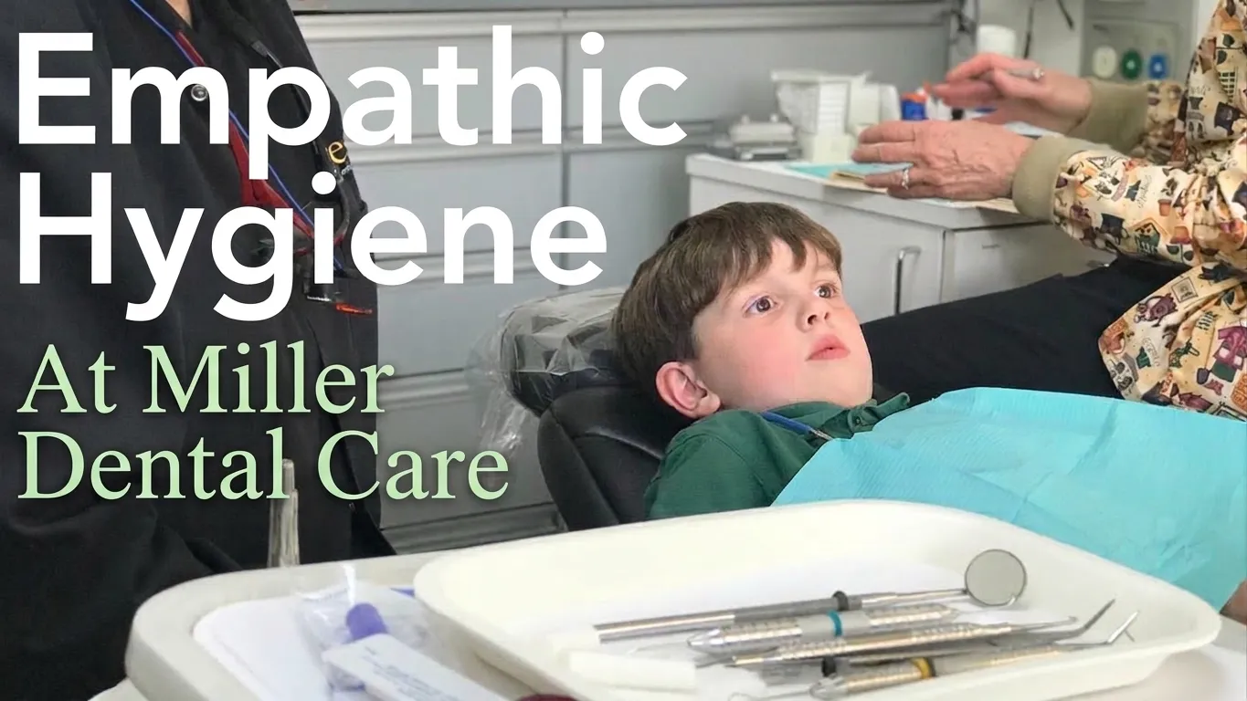 A gentle, empathetic hygienist reassuring a young patient at Miller Dental Care in Orillia