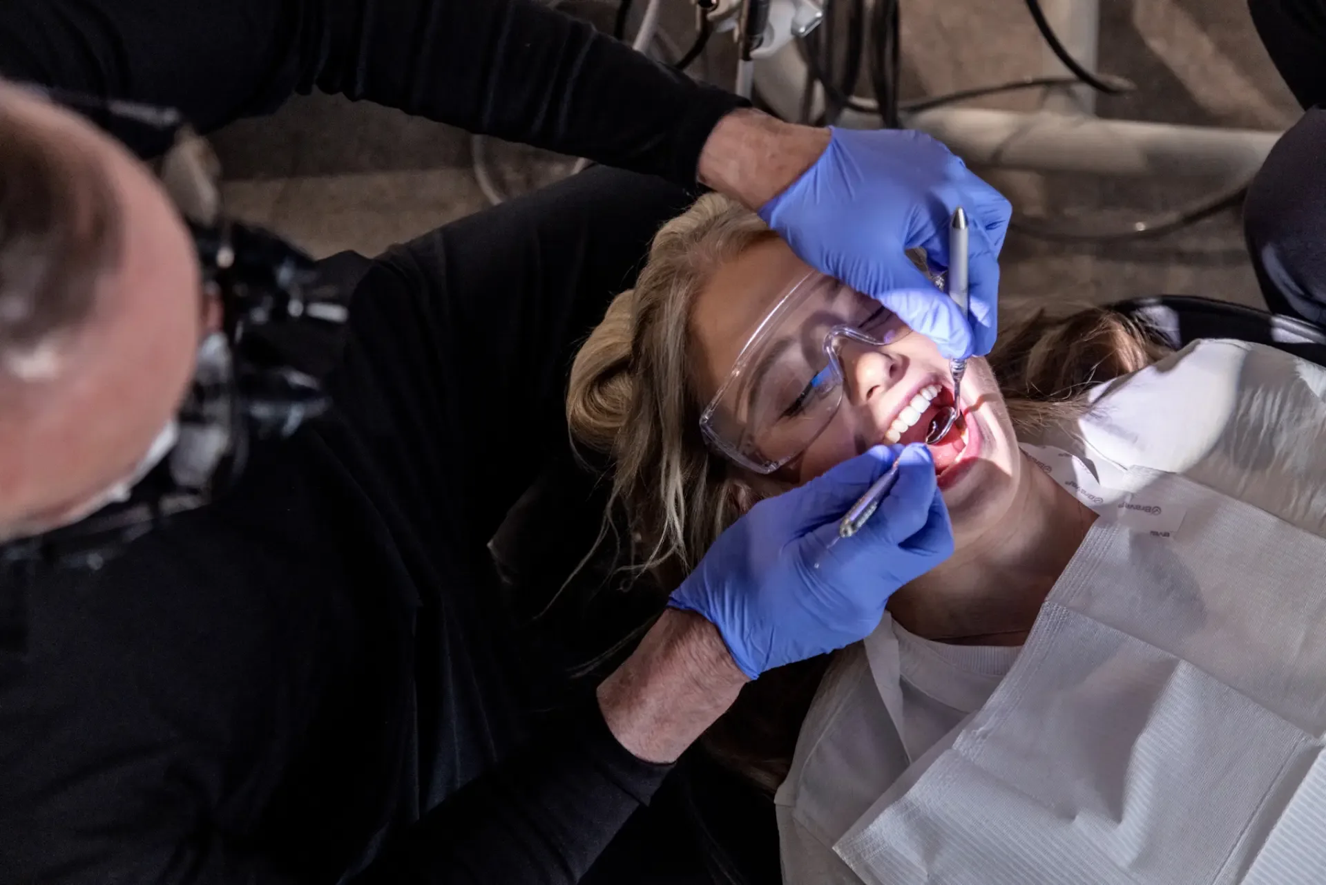 Dental professional preparing a patient for an oral surgery procedure