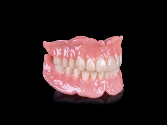 A premium denture with natural-looking, multi-layered teeth from Miller Dental Care in Orillia
