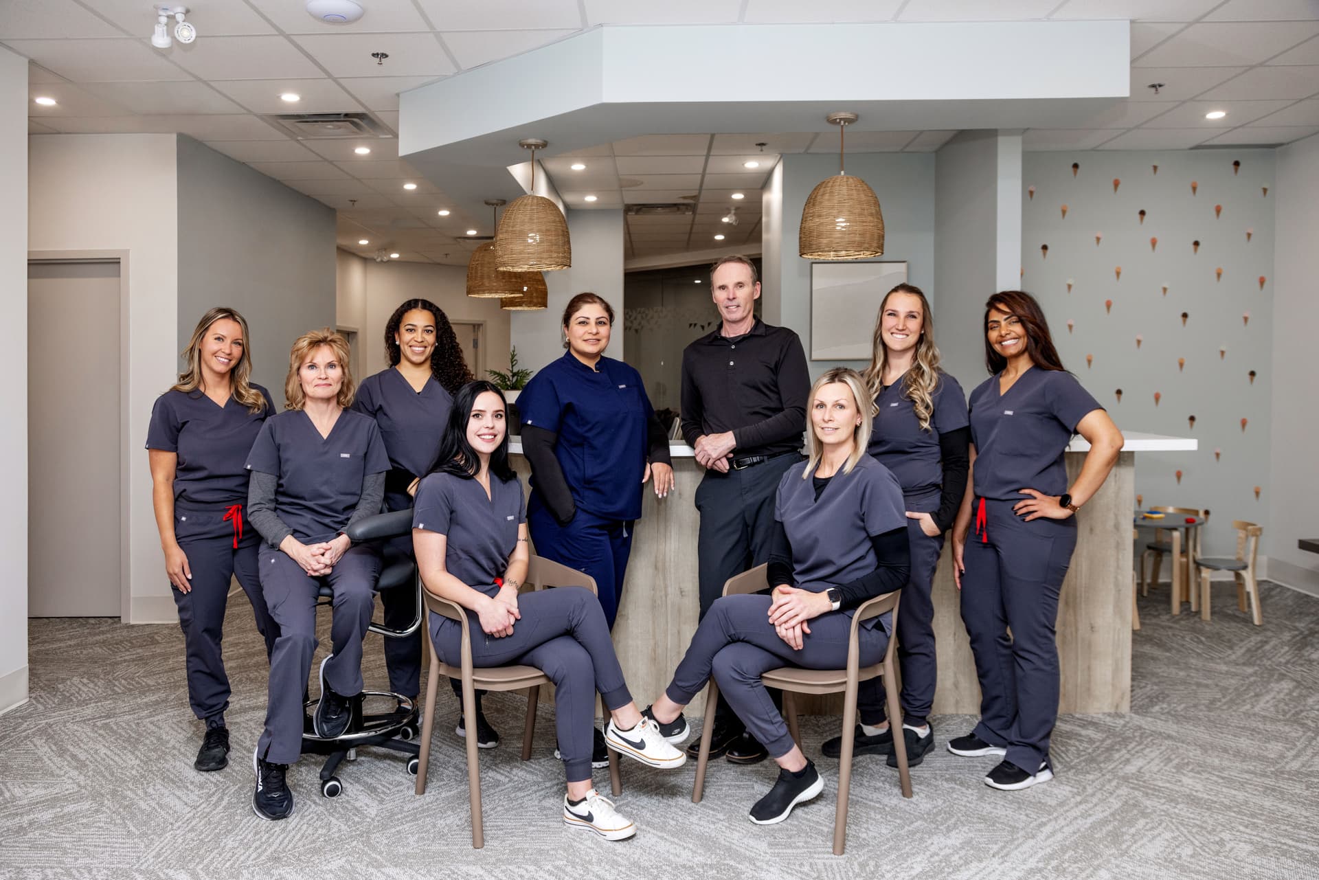 A group shot of the dental healthcare team at Miller Dental Care—they are waiting to answer any questions you might have about dental surgery.